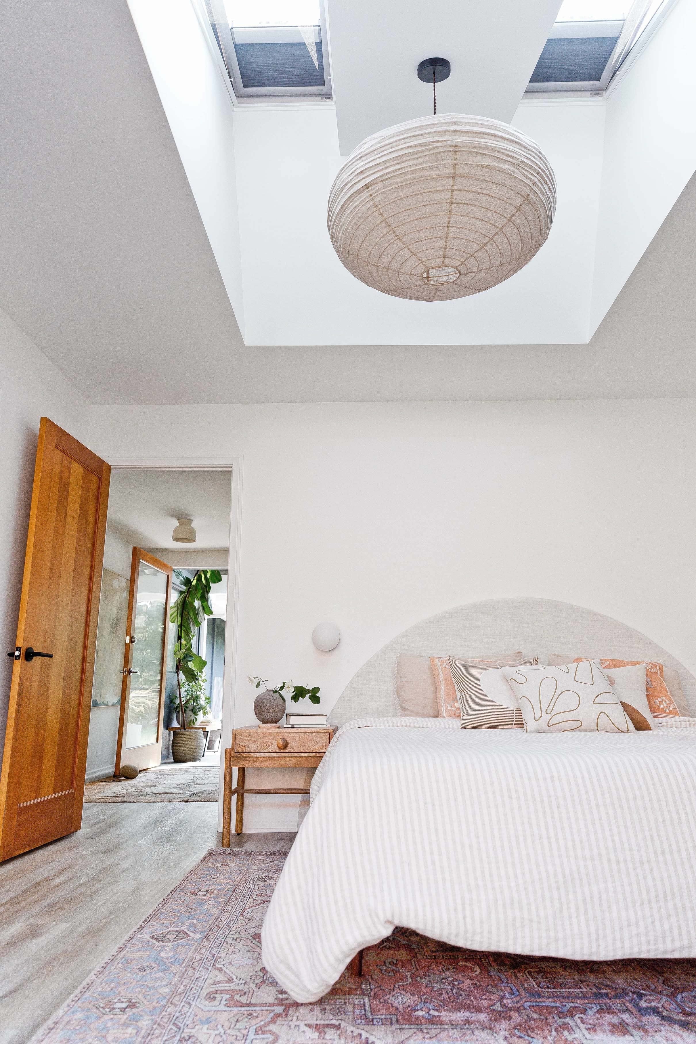 Bedroom skylights taupe pink bedding paper lantern