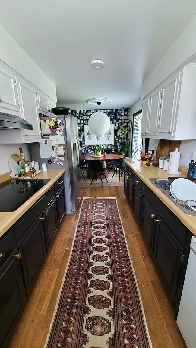 Galley kitchen before skylights installed black and white