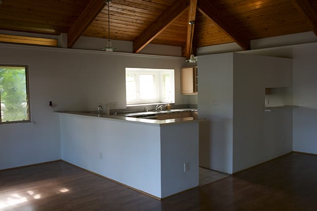 White kitchen wood ceiling before skylights installed